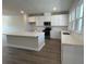 Modern kitchen with white cabinets, stainless steel appliances, and a central island at 5120 Double Eagle, Summerville, SC 29485