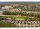 Stunning aerial view of homes nestled along a lush golf course with scenic natural surroundings at 5358 Birdie Ln, Hollywood, SC 29449