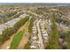 Scenic aerial shot of a residential area bordering a golf course and a serene pond at 5358 Birdie Ln, Hollywood, SC 29449