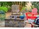 Outdoor patio with comfortable furniture and fireplace at 5358 Birdie Ln, Hollywood, SC 29449