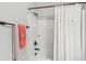 Clean bathroom with a neutral color scheme featuring a shower/tub combo with white tiles and a shower curtain at 5358 Birdie Ln, Hollywood, SC 29449