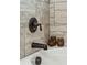 Close up of modern faucet, tub and tile with decorative owls at 5358 Birdie Ln, Hollywood, SC 29449