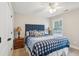 Comfortable bedroom with nautical-themed bedding, bedside tables, and plenty of natural light from the windows at 5358 Birdie Ln, Hollywood, SC 29449