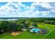 Aerial shot of a community featuring a pool, playground, and recreational area at 5358 Birdie Ln, Hollywood, SC 29449