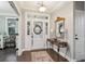 Inviting foyer with a decorative mirror and a view to a nearby room at 5358 Birdie Ln, Hollywood, SC 29449
