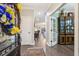 Welcoming foyer with hardwood floors, elegant furnishings, and open floorplan at 5358 Birdie Ln, Hollywood, SC 29449