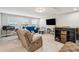 Spacious living room with comfortable seating, a large TV, and plenty of natural light through the windows at 5358 Birdie Ln, Hollywood, SC 29449
