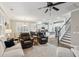 Bright, open floor plan with kitchen, dining area, and living room, filled with natural light and modern decor at 5358 Birdie Ln, Hollywood, SC 29449