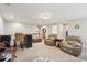 Open living area with carpeting, a bar area, a neutral palette, and lots of space for entertaining at 5358 Birdie Ln, Hollywood, SC 29449