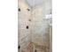 Modern shower features decorative stone floor, rain shower head and glass door at 5358 Birdie Ln, Hollywood, SC 29449