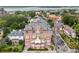 Stunning aerial shot of historic brick apartment building surrounded by lush greenery and charming neighborhood at 55 Ashley Ave # 19, Charleston, SC 29401