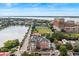 Expansive aerial view showcases the charming town, a tranquil lake, and modern buildings at 55 Ashley Ave # 19, Charleston, SC 29401