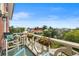 Charming balcony with views of the city featuring seating and lovely flower boxes on the railing at 55 Ashley Ave # 19, Charleston, SC 29401