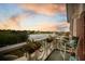 Charming balcony view overlooking a serene lake at sunset, complete with stylish furnishings and decor at 55 Ashley Ave # 19, Charleston, SC 29401