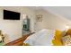 A bedroom space with television and comfortable seating area, creating a warm and inviting atmosphere at 55 Ashley Ave # 19, Charleston, SC 29401