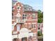 Charming brick building, known as The Baker House, showcases unique architectural details and inviting balconies at 55 Ashley Ave # 19, Charleston, SC 29401