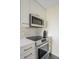 Updated kitchen featuring stainless steel appliances, white cabinets, and gold hardware and backsplash at 55 Ashley Ave # 19, Charleston, SC 29401