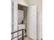 Convenient laundry closet with a stackable washer and dryer unit tucked away behind white doors at 55 Ashley Ave # 19, Charleston, SC 29401
