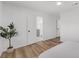 Spacious bedroom with wood floors and a door to the ensuite bath at 6 Allison Ct, Charleston, SC 29407
