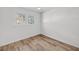 Bedroom with hardwood floors, closet, and window at 6 Allison Ct, Charleston, SC 29407
