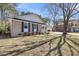 A charming brick home with black shutters and manicured landscaping is nestled on a spacious lot at 6 Allison Ct, Charleston, SC 29407