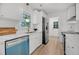 Modern kitchen with stainless steel appliances, white cabinets, and ample natural light from a window above the sink at 6 Allison Ct, Charleston, SC 29407