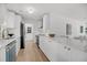 Bright modern kitchen featuring white cabinets, stainless appliances, and quartz countertops at 6 Allison Ct, Charleston, SC 29407