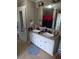Bathroom with a double sink vanity, tiled floors, and a decorative floor mat at 60 Caboose Ct, Cottageville, SC 29435