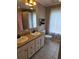 Bathroom featuring a double sink vanity, tiled floors, and a shower with a curtain at 60 Caboose Ct, Cottageville, SC 29435