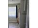 Bathroom featuring neutral tones, patterned shower curtain, and tiled flooring at 60 Caboose Ct, Cottageville, SC 29435
