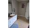Functional bathroom featuring a sink with a vanity, tiled floors, and a shower at 60 Caboose Ct, Cottageville, SC 29435