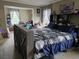 Bedroom with a bed and a large opening to another room for versatile living at 60 Caboose Ct, Cottageville, SC 29435