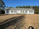 Charming single-story home featuring black shutters and a welcoming front porch with a ramp at 60 Caboose Ct, Cottageville, SC 29435