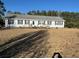 Charming single-story home featuring black shutters and a welcoming front porch with a ramp at 60 Caboose Ct, Cottageville, SC 29435