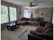 Comfortable living room features a sectional sofa and large windows for natural light at 60 Caboose Ct, Cottageville, SC 29435