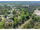 Lush trees surround this home, as seen from an aerial view, providing a serene and private setting at 6273 Ballpark Rd Rd, Hollywood, SC 29449