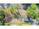 Aerial view of a home on a large lot, close to the road, and surrounded by mature trees at 6273 Ballpark Rd Rd, Hollywood, SC 29449