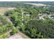 An aerial view showing a house surrounded by beautiful, mature trees that offer shade and privacy at 6273 Ballpark Rd Rd, Hollywood, SC 29449