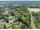 Expansive aerial view of a home nestled among lush trees, offering both privacy and a sense of community at 6273 Ballpark Rd Rd, Hollywood, SC 29449