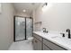 Contemporary bathroom featuring double vanity, tiled floors, and glass shower at 6273 Ballpark Rd Rd, Hollywood, SC 29449