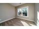 Bright, carpeted bedroom featuring a large window and a neutral color scheme at 6273 Ballpark Rd Rd, Hollywood, SC 29449