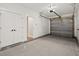 Spacious two car garage features concrete flooring, garage door and access door to the main house at 6273 Ballpark Rd Rd, Hollywood, SC 29449