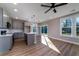Bright kitchen features wood-look floors, grey cabinets, stainless appliances, and an adjacent dining area at 6273 Ballpark Rd Rd, Hollywood, SC 29449