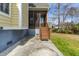 View of back porch with wooden stairs and a peaceful view of the yard and pond at 644 Stoneboro Ct, Charleston, SC 29412