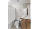 A clean bathroom with tile floors, a toilet, a sink with wood-colored cabinets, and a tub at 644 Stoneboro Ct, Charleston, SC 29412