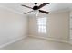 Bright bedroom with neutral carpet, ceiling fan, and a window that allows natural light to fill the space at 644 Stoneboro Ct, Charleston, SC 29412