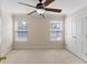Bedroom featuring carpet, ceiling fan, natural light, and a double door closet at 644 Stoneboro Ct, Charleston, SC 29412