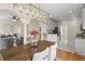 Open floor plan dining area features a modern chandelier, adjacent to kitchen and living room at 644 Stoneboro Ct, Charleston, SC 29412
