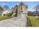 Two-story home featuring a concrete driveway and manicured green lawn at 644 Stoneboro Ct, Charleston, SC 29412