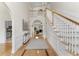 Elegant entryway featuring high ceilings, hardwood floors, and staircase at 644 Stoneboro Ct, Charleston, SC 29412